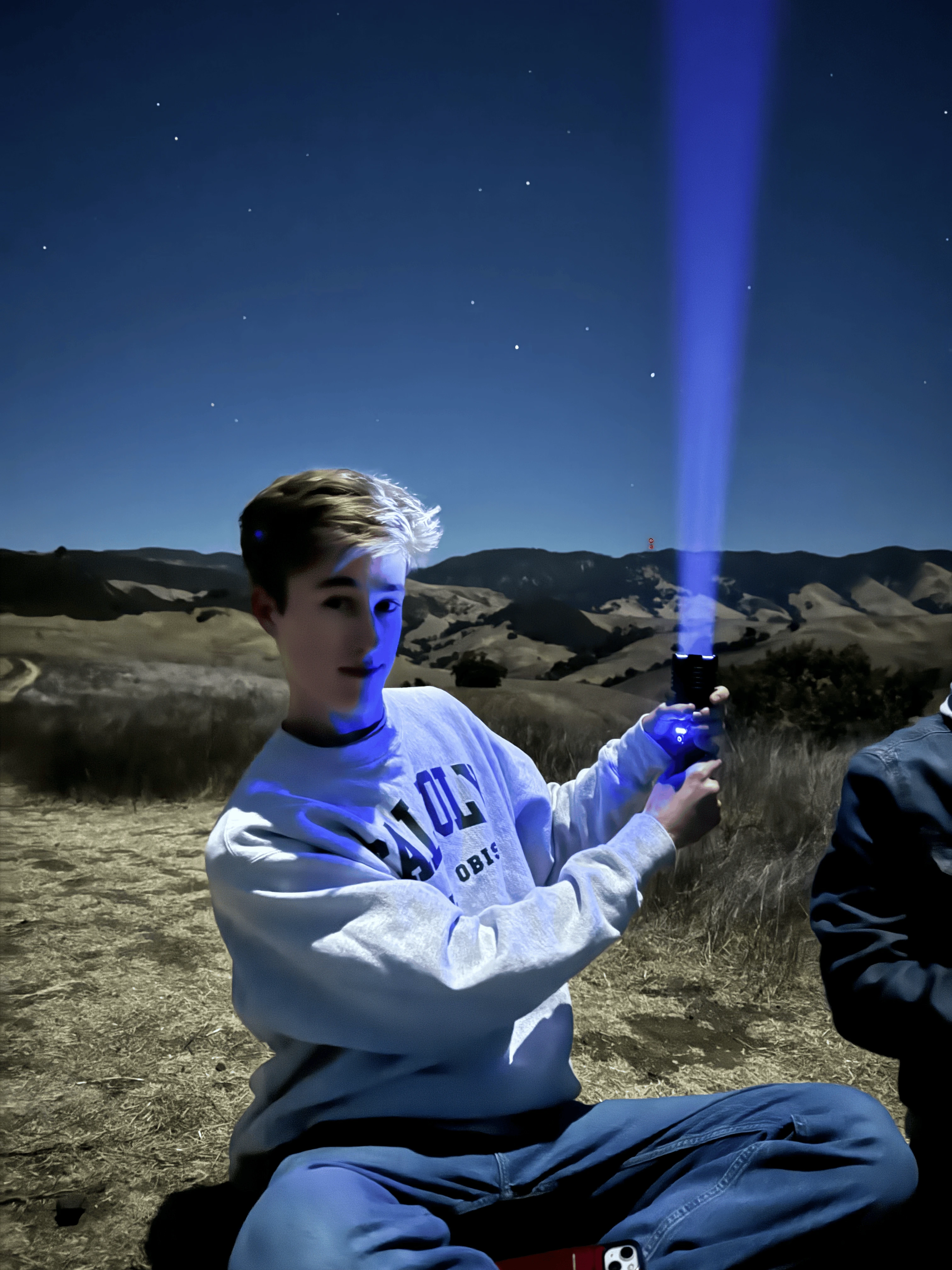 Bowie holds a flashlight